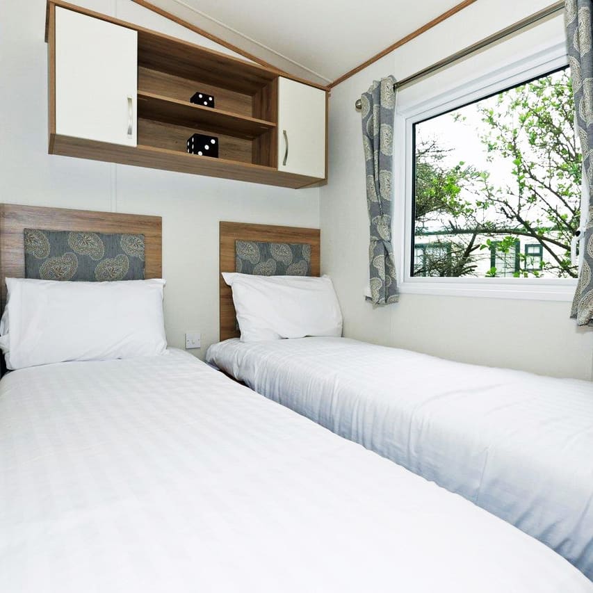 The twin bedroom of our bright and spacious luxury static caravan. The perfect way to stay.