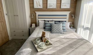 The double bedroom at one of our spacious static caravans in St Ives. Book your holiday now! image
