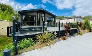 Exterior of one of our stunning lodges for sale at Tattershall Lakes. image