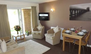 The lounge area of our bright and spacious superior chalet. The perfect way to stay. image