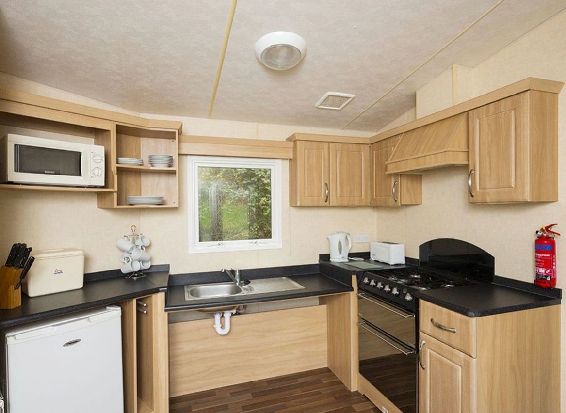 The kitchen area of our accessibility adapted static caravan. The perfect way to stay. image