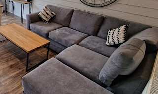 The lounge area of our stunning holiday home at The Lakes Rookley, the Island Cottage. image