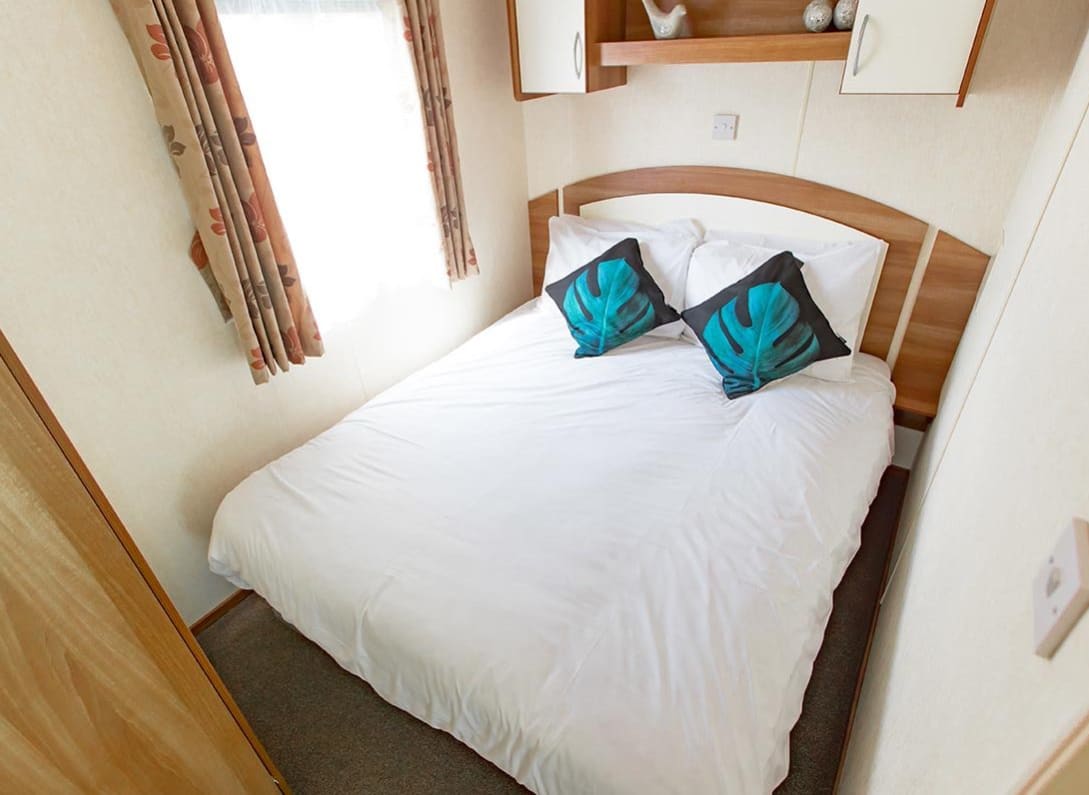 The double bedroom of our budget-friendly value static caravan. The perfect way to stay. image