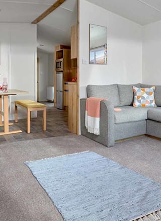 The bright and spacious lounge area of one of our Comfort Caravans at The Lakes Rookley.