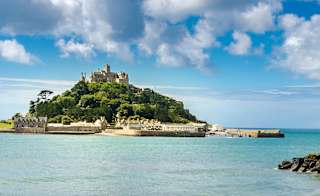 A view of Mounts Bay, Cornwall, on a cloudy but sunny day. There are views of the glorious blue sea and the mount in the distance. image