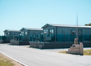 Exterior of our lodges at Mill Rythe Holiday Park, Hampshire. image