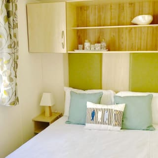 The double bedroom in our bright and spacious superior static caravan. The perfect way to stay.