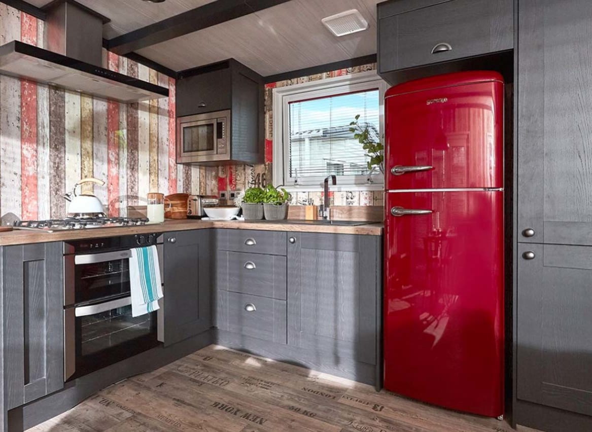 The kitchen area of one of our exclusive accommodations, The TriBeCa. Book your holiday now! image