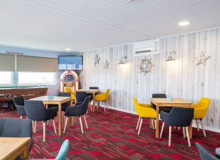 The seating area at The Muddy Duck Clubhouse in our Essex holiday park, Mersea Island. image