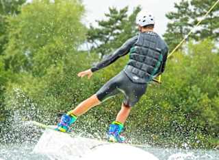 A male enjoying some watersports at the New Forest Water Park. image