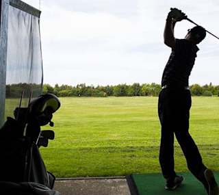 A person enjoying an afternoon at The Driving Range at Appletree Holiday Park, Lincolnshire. image