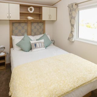 The double bedroom of our bright and spacious luxury static caravan. The perfect way to stay.