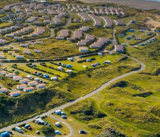Our St Ives Bay holiday park. There are plenty of amazing holiday homes onsite, with a sandy beach running alongside, that meets the sea. There is also plenty of green space surrounding the park.