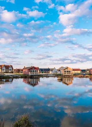 Holiday lodges looking out to a lake at The Bay Filey, Yorkshire, Away Resorts.