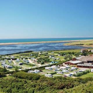 A drone image of our camping and touring park in Dorset, East Fleet Farm with views of the lagoon. image