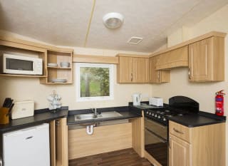 The kitchen area of our accessibility adapted static caravan. The perfect way to stay. image