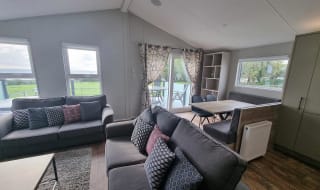 The living and lounge area of one of our exclusive accommodations, The Seaview Lodge. Book your holiday now! image