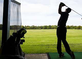 A person enjoying an afternoon at The Driving Range at Appletree Holiday Park, Lincolnshire. image