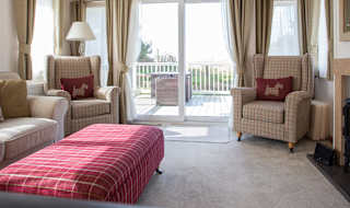 The lounge area of our bright and spacious indulgent static caravan. The perfect way to stay. image