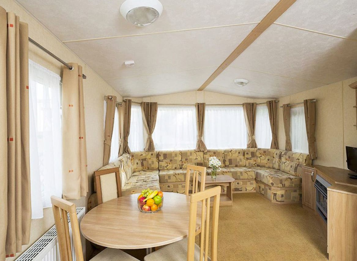 The living and dining area of our accessibility adapted static caravan. The perfect way to stay. image