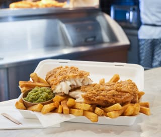 Fish and chips with a side of mushy peas at our Catch 22 venue.