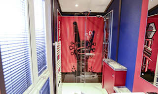 The shower and bathroom of one of our exclusive accommodations, The Rockstar. Book your holiday now! image