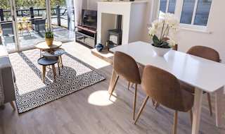 The lounge area of The Lakehouse at The Lakes Rookley. The perfect way for the family to stay. image