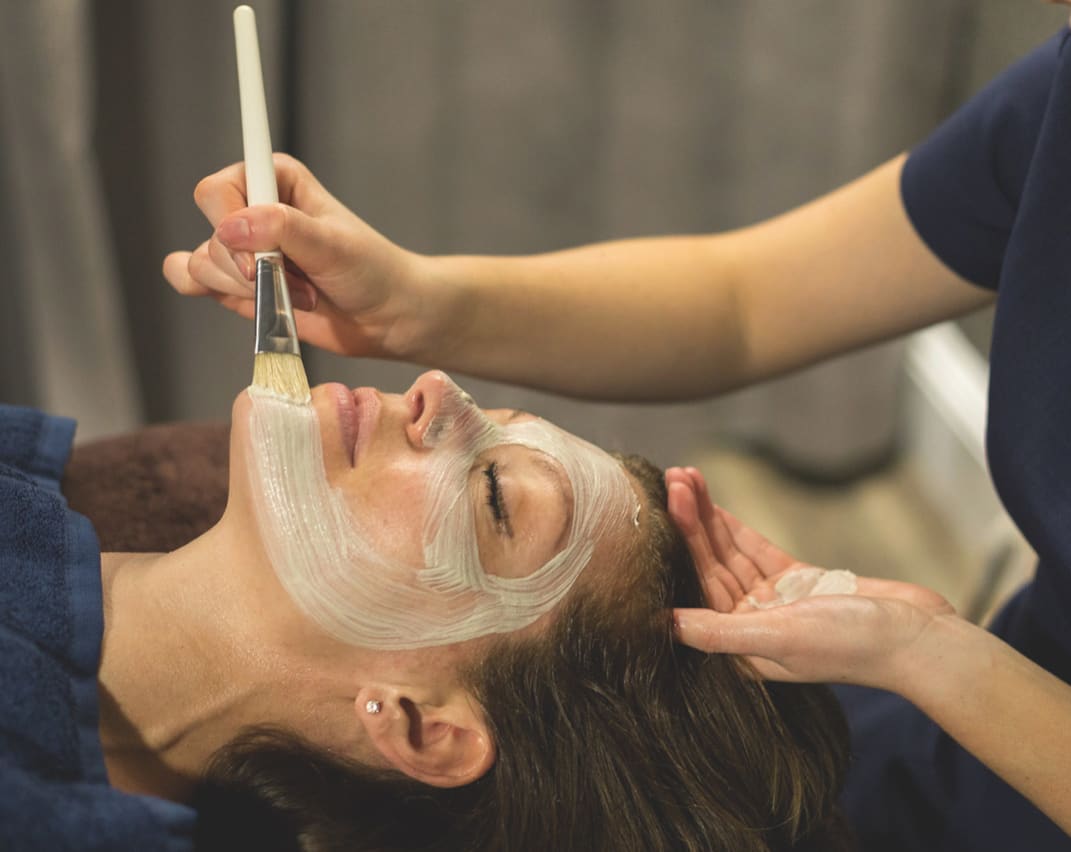 A woman enjoying a spa experience at Retallack Resort, Cornwall.