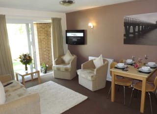The lounge area of our bright and spacious superior chalet. The perfect way to stay. image