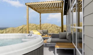 A bright sunny day at our St Ives park with stunning views from our hot tubs. image