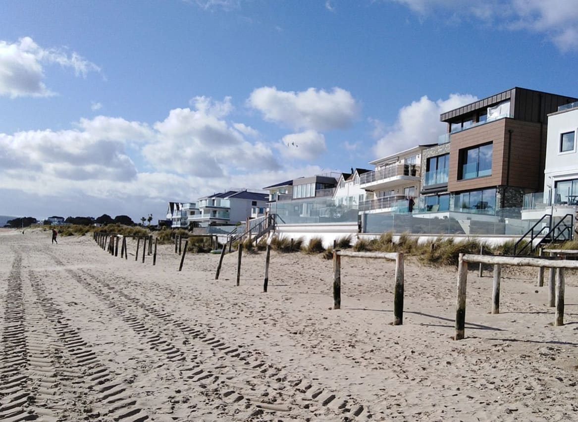 An image of Sandbanks Beach in Dorset. You can see the golden sand and houses overlooking the beach. image