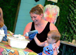 Mum and daughter creating their tie dye tops in one of our fun activities. image