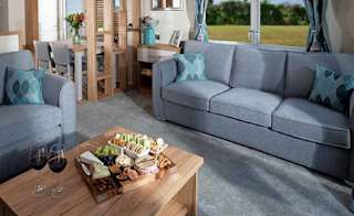 The lounge area of our bright and spacious luxury static caravan at St Helens holiday park. The perfect way to stay. image