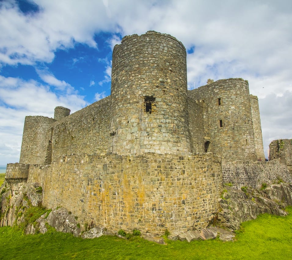 An image of Harlech Castle in North Wales on a sunny, cloudy day. image