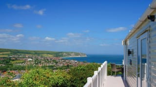 A view of the sea and surrounding area from the balcony of one of our stunning holiday homes at Swanage Bay View.