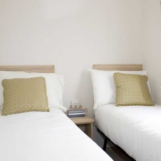 The twin bedroom in our bright and spacious comfort static caravan. The perfect way to stay.