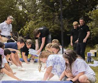 A group of people participating in a group activity.
