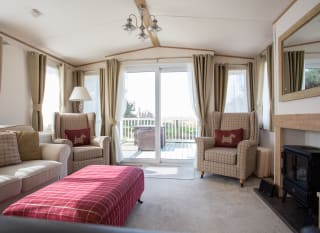 The lounge area of our bright and spacious indulgent static caravan. The perfect way to stay. image