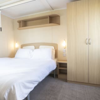 Comfortable double bed with pillows & linen included