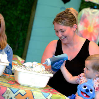 Mum and daughter creating their tie dye tops in one of our fun activities. image