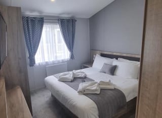 The double bedroom of one of our exclusive accommodations, The Seaview Lodge. Book your holiday now! image