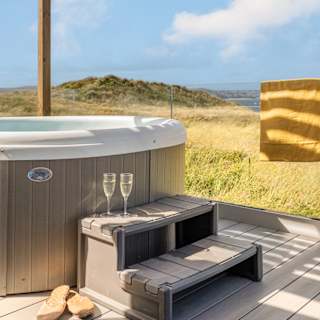 A bright sunny day at our St Ives park with stunning views from our hot tubs.