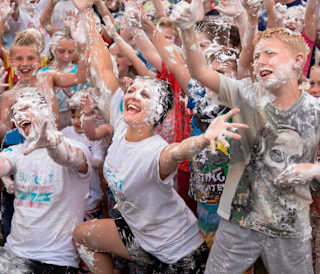 A group of people enjoying our awesome event, the Custard Pie Fight!