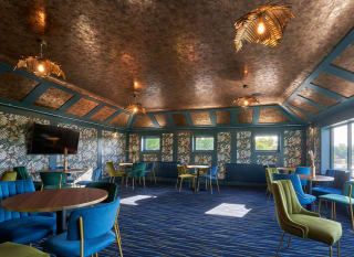Seating area inside the Tipsy Eagle Bar at Appletree Holiday Park. image