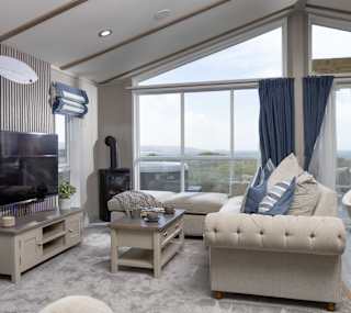The living area of one of our spacious static caravans in St Ives. Book your holiday now! image