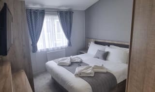 The double bedroom of one of our exclusive accommodations, The Seaview Lodge. Book your holiday now! image