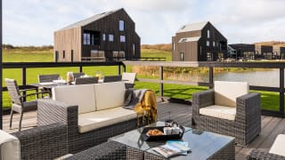 Exterior of barn area at Retallack Resort and Spa overlooking the lake and beautiful Cornish countryside. image