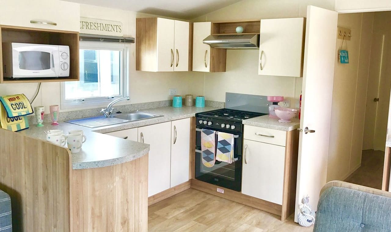 The kitchen area of our bright and spacious superior static caravan. The perfect way to stay. image