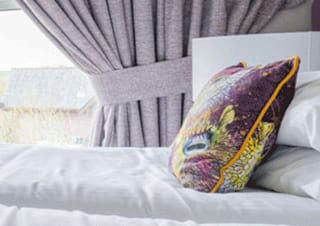 Comfortable double bed with pillows & linen included