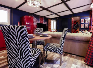 The dining area of one of our exclusive accommodations, The Rockstar. Book your holiday now! image